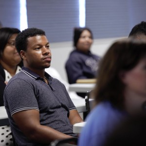 SMU Student listens closely during class lecture